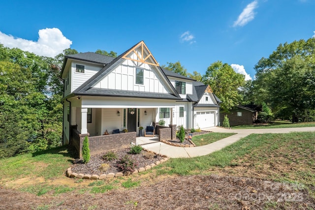 685 Knollcrest Dr NE, Concord, NC 28025 - modern farmhouse style home featuring board and batten siding, a porch, driveway, and a front lawn