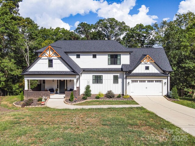 685 Knollcrest Dr NE, Concord, NC 28025 - modern farmhouse style home featuring board and batten siding, a porch, a front yard, a shingled roof, and concrete driveway