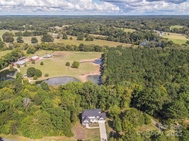 685 Knollcrest Dr NE, Concord, NC 28025 - view of property location featuring a nearby body of water and a heavily wooded area