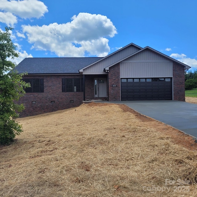 8222 Madison Ln, Hickory, NC 28602 - single story home featuring brick siding, a garage, concrete driveway, and a shingled roof