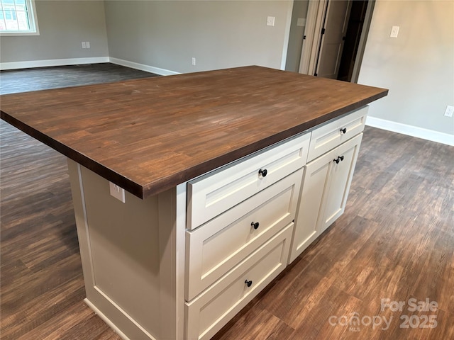 8222 Madison Ln, Hickory, NC 28602 - kitchen with wood counters, dark wood-style floors, baseboards, and white cabinets