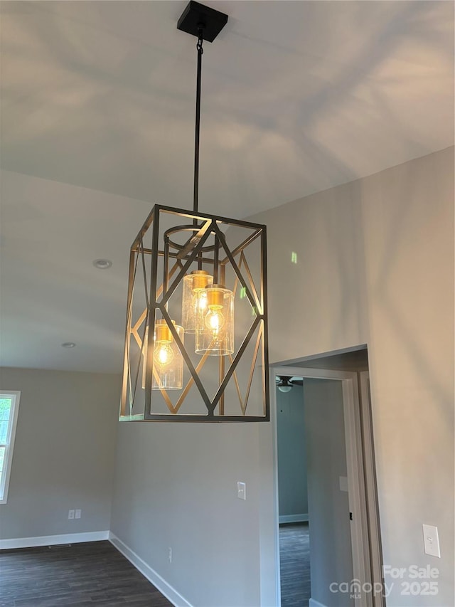 8222 Madison Ln, Hickory, NC 28602 - detailed view of baseboards, wood finished floors, and ceiling fan