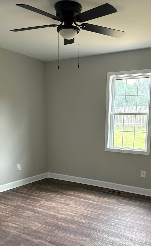 8222 Madison Ln, Hickory, NC 28602 - spare room featuring dark wood finished floors, a ceiling fan, and baseboards