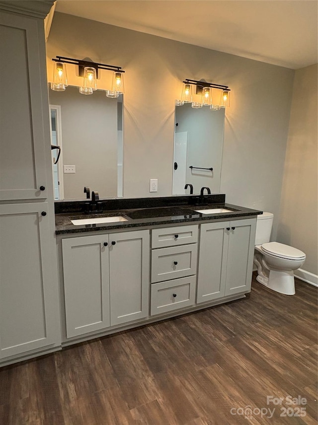 8222 Madison Ln, Hickory, NC 28602 - bathroom with toilet, wood finished floors, and double vanity
