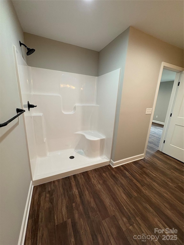 8222 Madison Ln, Hickory, NC 28602 - full bathroom featuring wood finished floors, a shower, and baseboards