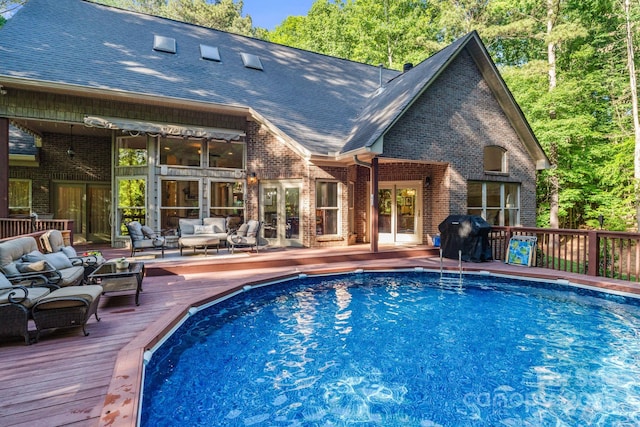 131 Sierra Woods Dr, Troutman, NC 28166 - view of swimming pool featuring a wooden deck, french doors, an outdoor hangout area, and grilling area