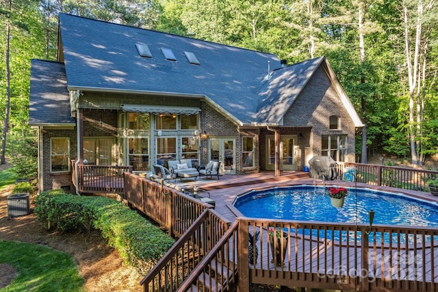 131 Sierra Woods Dr, Troutman, NC 28166 - view of swimming pool featuring a wooden deck and an outdoor hangout area