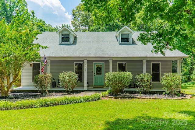 3387 Passmore Rd, Rock Hill, SC 29730 - new england style home featuring covered porch, a front yard, and a shingled roof