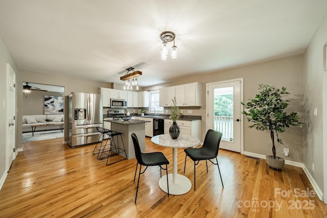 3387 Passmore Rd, Rock Hill, SC 29730 - dining space featuring light wood-style floors, baseboards, and ceiling fan