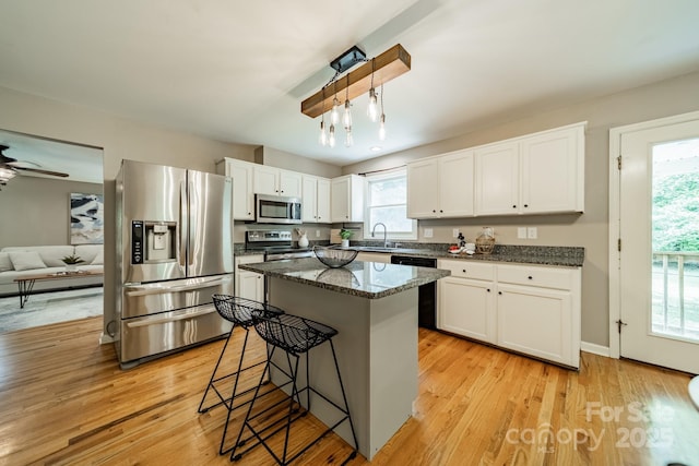 3387 Passmore Rd, Rock Hill, SC 29730 - kitchen with appliances with stainless steel finishes, a sink, plenty of natural light, and white cabinetry