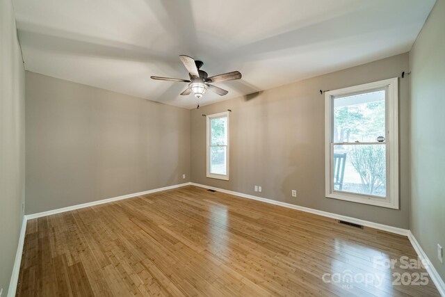 3387 Passmore Rd, Rock Hill, SC 29730 - empty room with light wood-style floors, ceiling fan, and baseboards