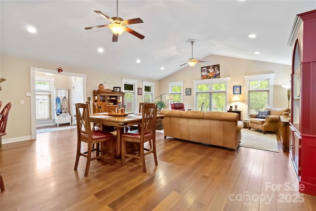 dining space featuring a ceiling fan, lofted ceiling, healthy amount of natural light, light wood-style floors, and recessed lighting
