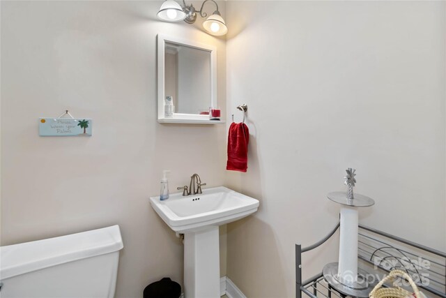 bathroom featuring toilet and a sink