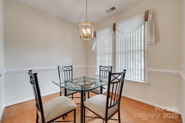 422 Garnet Ct, Fort Mill, SC 29708 - dining area featuring light wood-style flooring and a chandelier