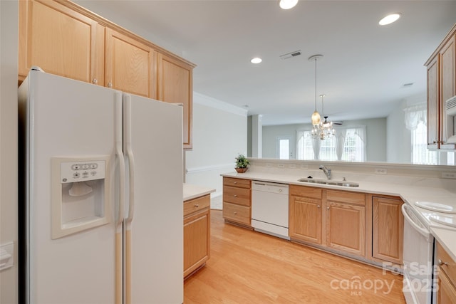 422 Garnet Ct, Fort Mill, SC 29708 - kitchen with white appliances, light countertops, light wood finished floors, recessed lighting, and hanging light fixtures