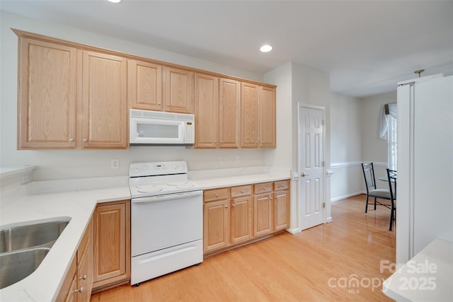 422 Garnet Ct, Fort Mill, SC 29708 - kitchen with white appliances, light brown cabinetry, light wood-type flooring, recessed lighting, and light stone counters