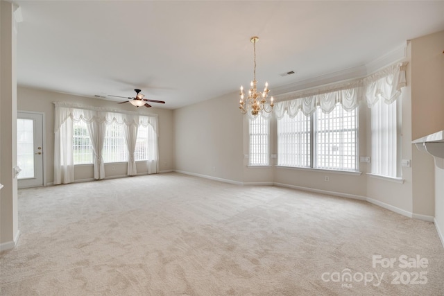 422 Garnet Ct, Fort Mill, SC 29708 - empty room featuring plenty of natural light, a ceiling fan, a chandelier, and carpet flooring
