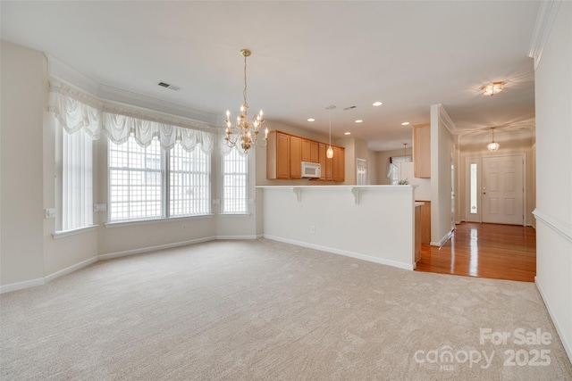 422 Garnet Ct, Fort Mill, SC 29708 - unfurnished living room with light colored carpet, a chandelier, ornamental molding, and recessed lighting
