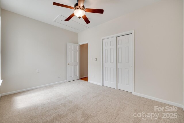 422 Garnet Ct, Fort Mill, SC 29708 - unfurnished bedroom featuring carpet, a closet, ceiling fan, and attic access