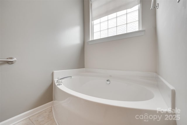 422 Garnet Ct, Fort Mill, SC 29708 - bathroom with a garden tub and tile patterned flooring