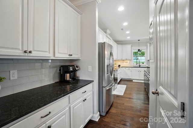 6314 Bluffton Ln, Midland, NC 28107 - kitchen with stainless steel fridge with ice dispenser, white cabinets, tasteful backsplash, dark wood-style flooring, and recessed lighting