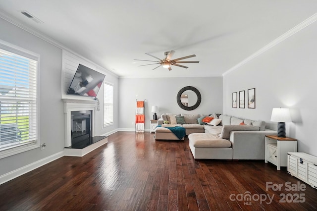 6314 Bluffton Ln, Midland, NC 28107 - living area featuring dark wood-type flooring, a ceiling fan, ornamental molding, and plenty of natural light