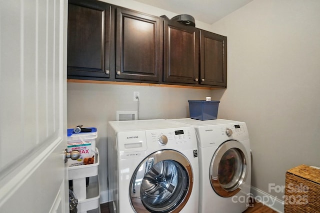 6314 Bluffton Ln, Midland, NC 28107 - laundry area with washer and dryer, cabinet space, baseboards, and wood finished floors