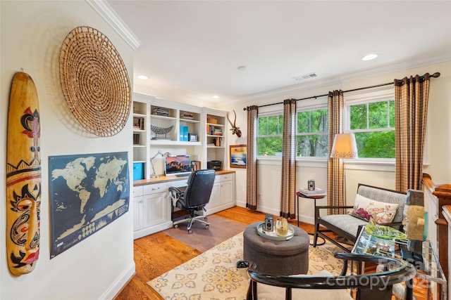 1701 Dearmon Dr, Charlotte, NC 28205 - home office featuring built in desk, light wood-type flooring, ornamental molding, recessed lighting, and baseboards
