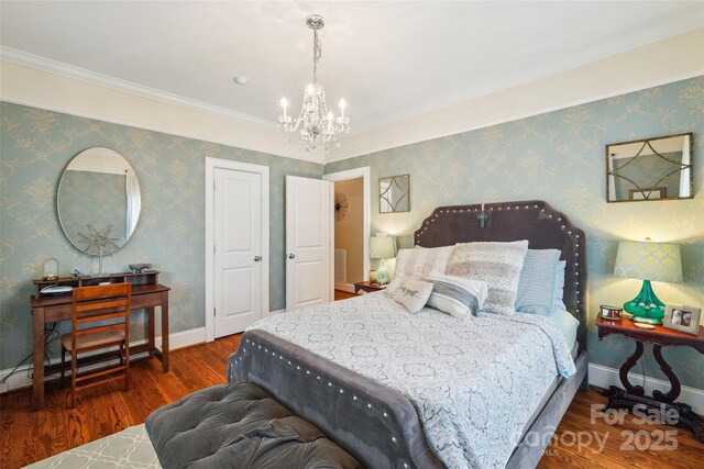 1701 Dearmon Dr, Charlotte, NC 28205 - bedroom featuring a chandelier, wood finished floors, baseboards, and ornamental molding