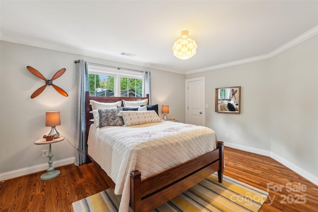 1701 Dearmon Dr, Charlotte, NC 28205 - bedroom featuring baseboards, wood finished floors, and ornamental molding