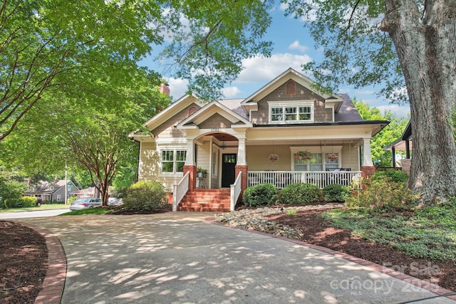 1701 Dearmon Dr, Charlotte, NC 28205 - craftsman-style house featuring a porch and a chimney