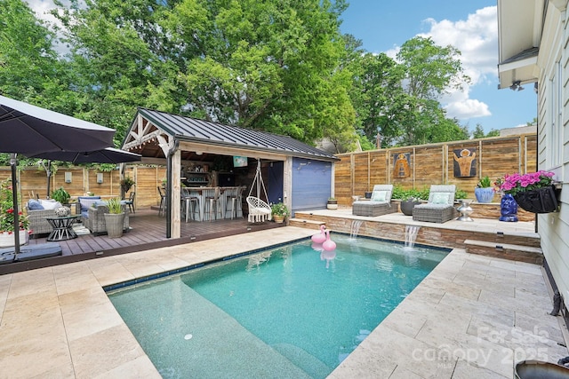 1701 Dearmon Dr, Charlotte, NC 28205 - view of swimming pool with a wooden deck, fence, an outdoor hangout area, a patio, and an outdoor structure