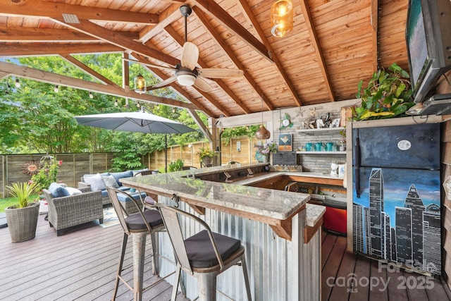 1701 Dearmon Dr, Charlotte, NC 28205 - wooden terrace with a fenced backyard and ceiling fan