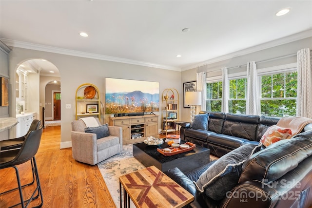 1701 Dearmon Dr, Charlotte, NC 28205 - living area featuring arched walkways, light wood-style floors, crown molding, and recessed lighting