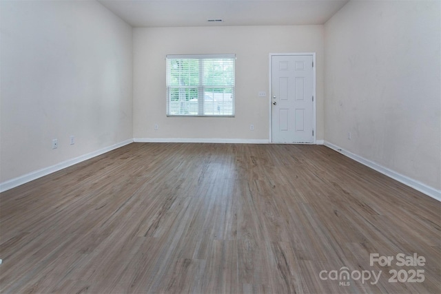 6717 Ware Rd, Charlotte, NC 28212 - unfurnished room with wood finished floors and baseboards