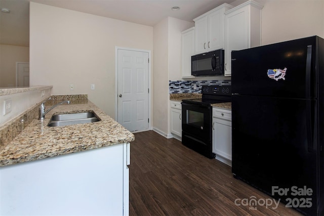 6717 Ware Rd, Charlotte, NC 28212 - kitchen featuring black appliances, a sink, dark wood-style floors, white cabinetry, and light stone countertops