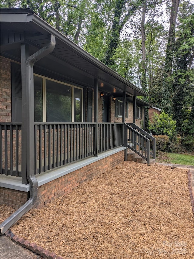 view of side of home featuring brick siding
