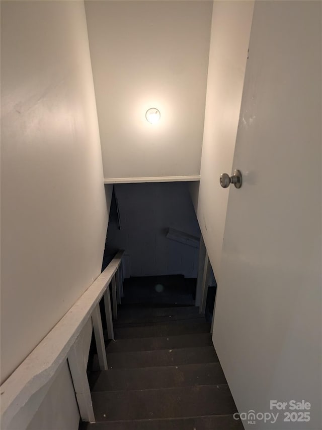 stairs with wood finished floors