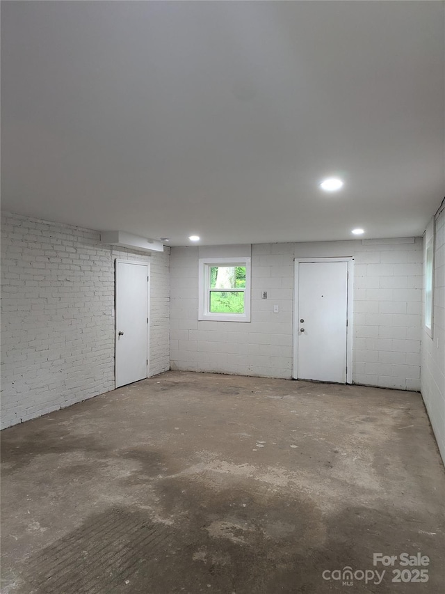 basement featuring concrete block wall