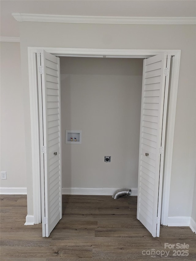 clothes washing area with hookup for a washing machine, dark wood-style floors, ornamental molding, electric dryer hookup, and baseboards