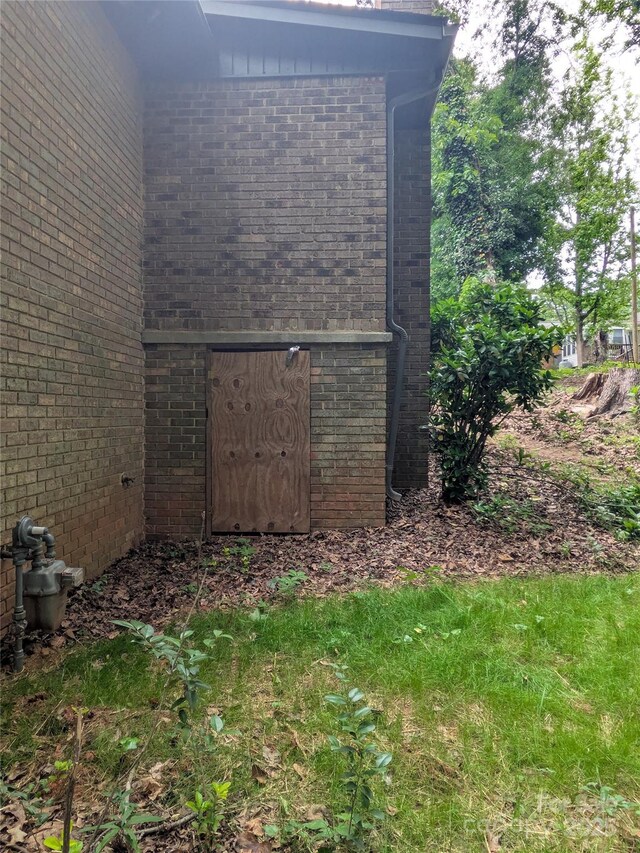 view of side of home featuring brick siding
