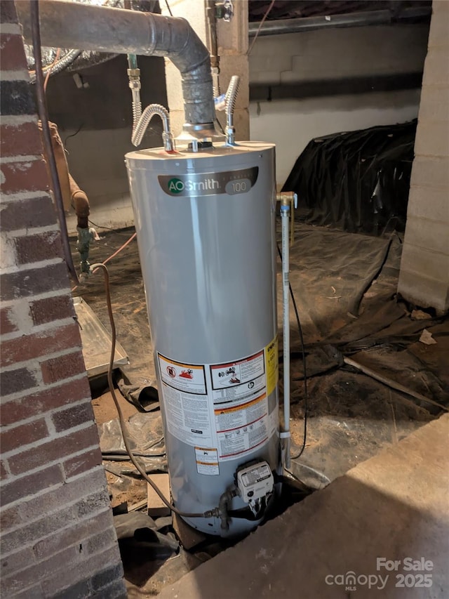 utility room featuring gas water heater