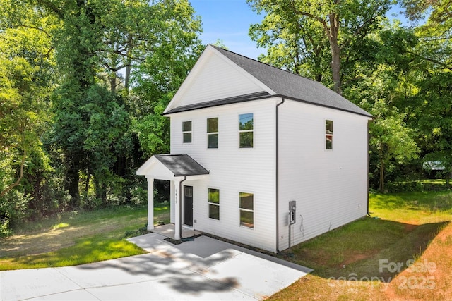 view of outbuilding featuring view of wooded area