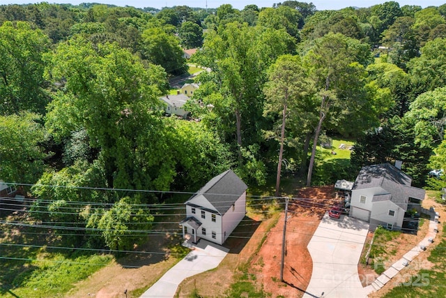 view from above of property with a forest
