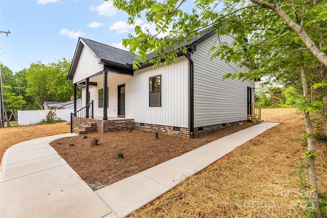 605 Stirewalt Rd, China Grove, NC 28023 - modern farmhouse style home with crawl space, a porch, roof with shingles, and fence