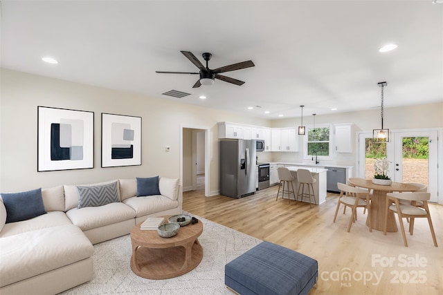 605 Stirewalt Rd, China Grove, NC 28023 - living room featuring recessed lighting, a ceiling fan, light wood-type flooring, and baseboards