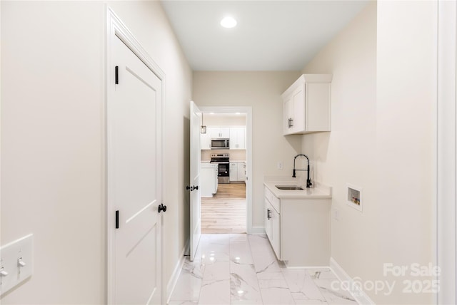 605 Stirewalt Rd, China Grove, NC 28023 - washroom featuring hookup for a washing machine, cabinet space, baseboards, light marble finish flooring, and recessed lighting