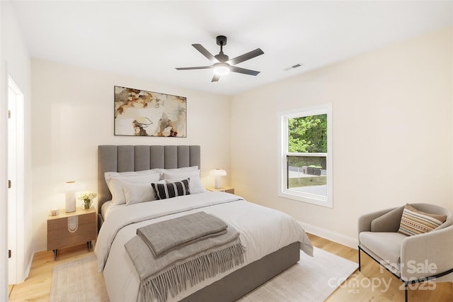 605 Stirewalt Rd, China Grove, NC 28023 - bedroom with light wood-type flooring, a ceiling fan, and baseboards