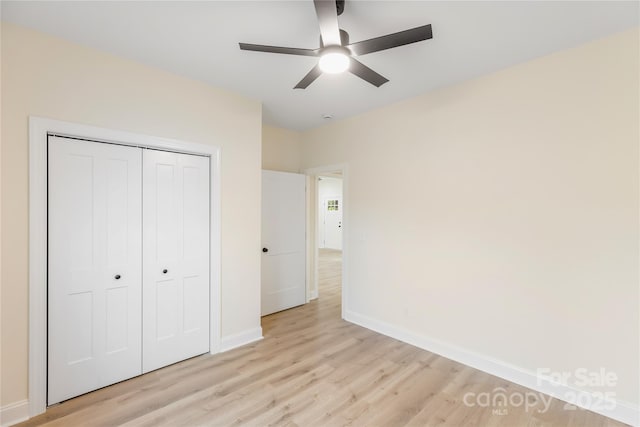605 Stirewalt Rd, China Grove, NC 28023 - unfurnished bedroom with light wood-type flooring, baseboards, a closet, and a ceiling fan