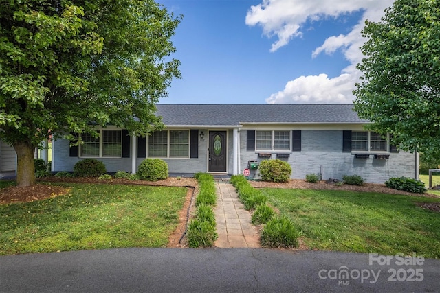 107 Pete Brittain Rd, Morganton, NC 28655 - ranch-style house featuring a front lawn, brick siding, and a shingled roof
